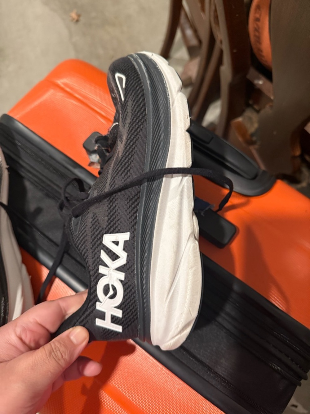 Hoka One One Black Running Shoe with Blue Logo Accents